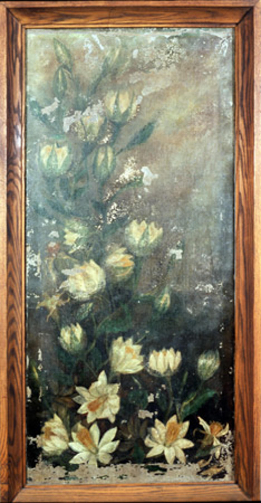 A framed artwork of flowers.