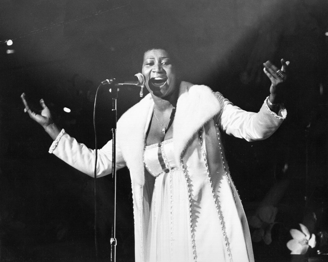 Aretha Franklin singing.