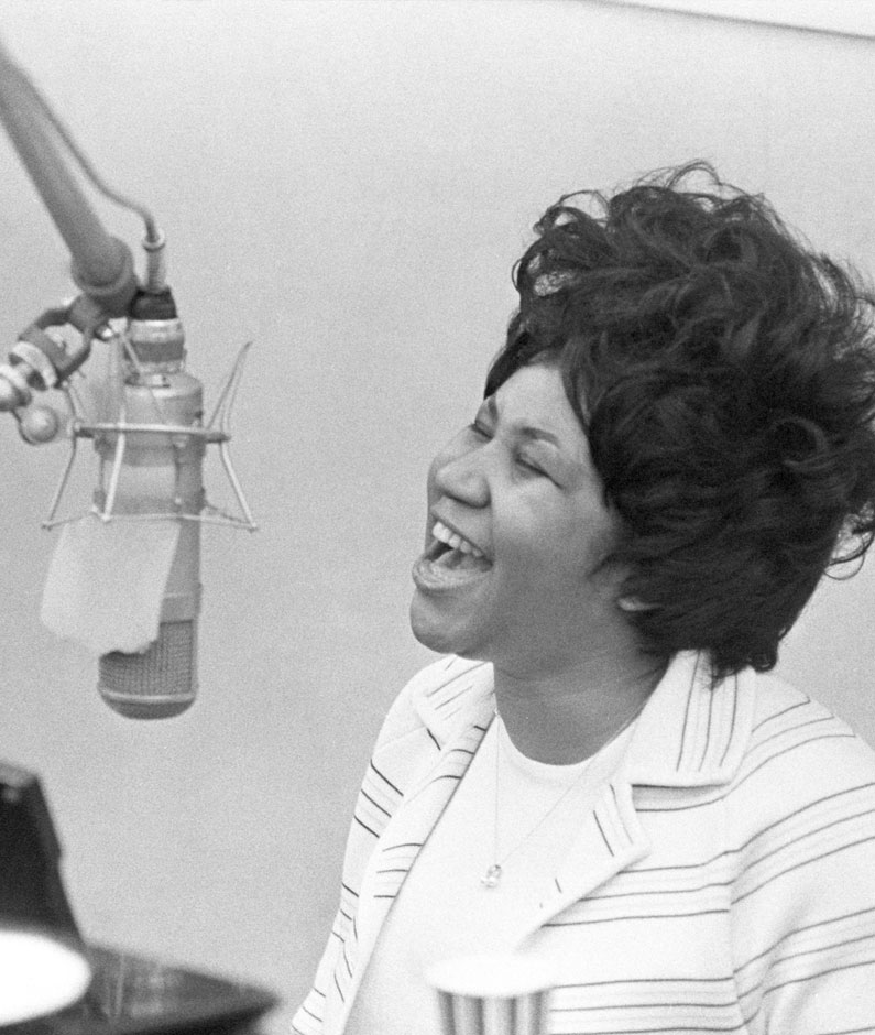 Aretha Franklin singing.