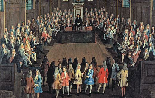 Members of the British Paliment standing in the Parlimentary chamber.