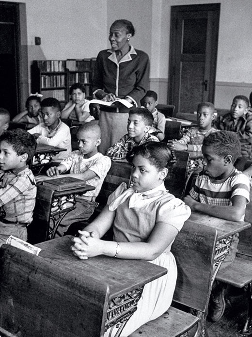 A classroom filled with African Amerian students and an African American teacher