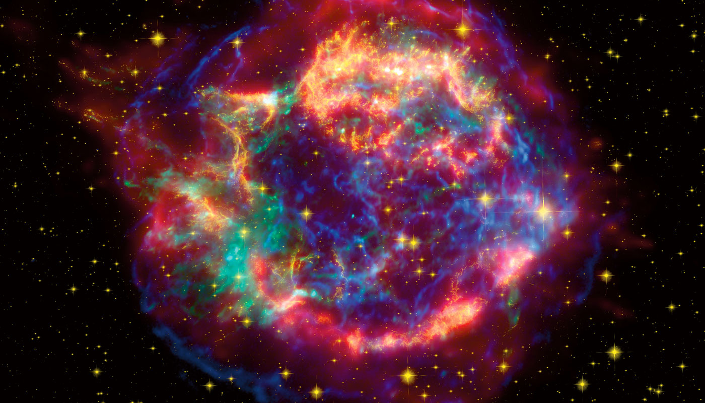 Large cloud of gas with areas that are being lit up light lightning and fireworks.