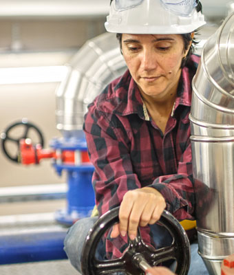 Photo of woman doing construction work.