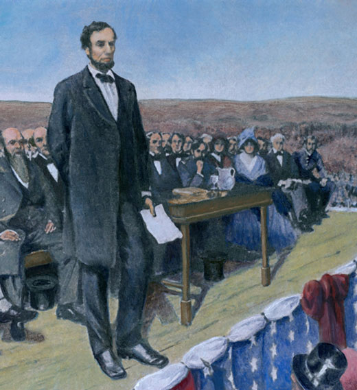 Abraham Lincoln stands on a stage to give his Gettysburg Address.