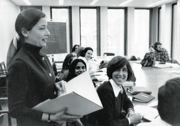 Ruth Bader Ginsburg standing in a room of students.