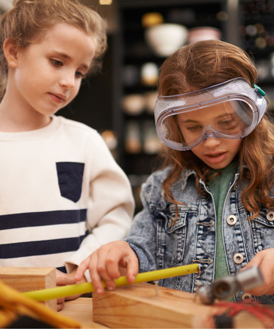 Photo of two girls in a shop class.