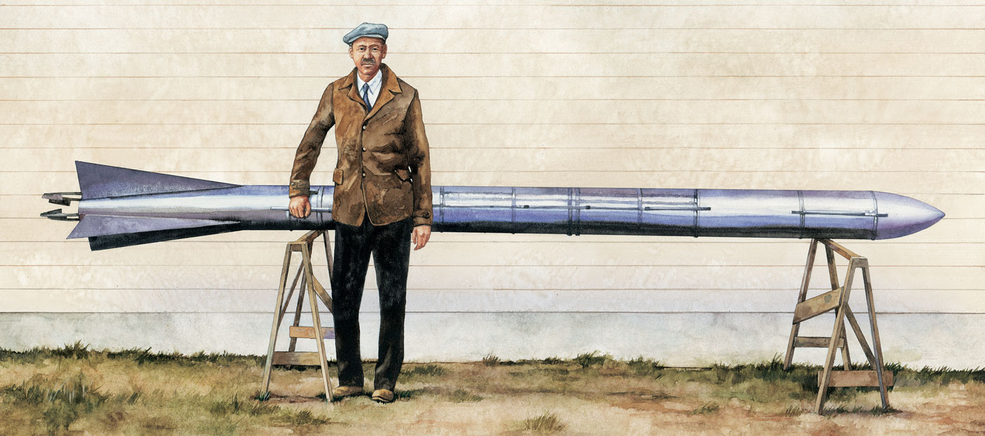 Robert Goddard standing in front of a rocket.