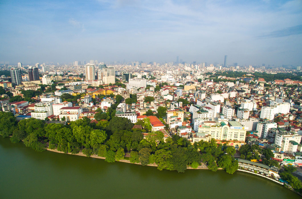 The city of Hanoi in Vietnam with a large area of land used for farming. 