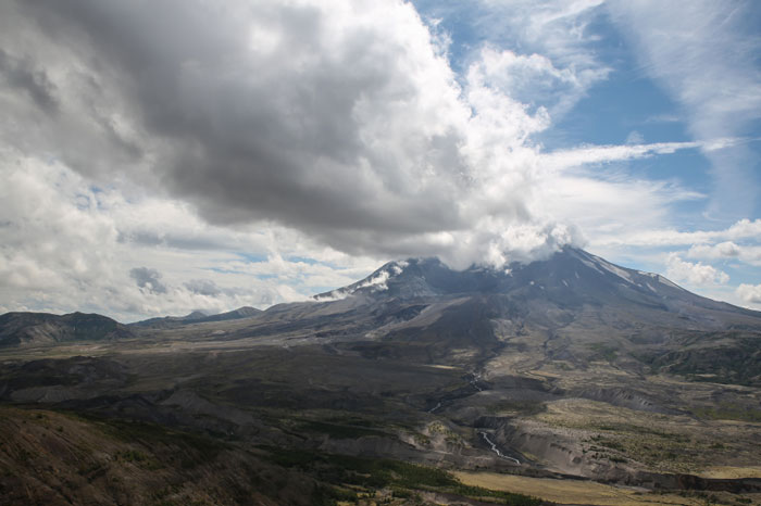 Mount Saint Helens with smoke coming out of it.