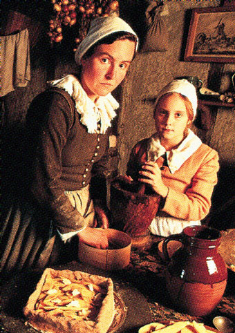 Mother and daughter working in the kitchen.