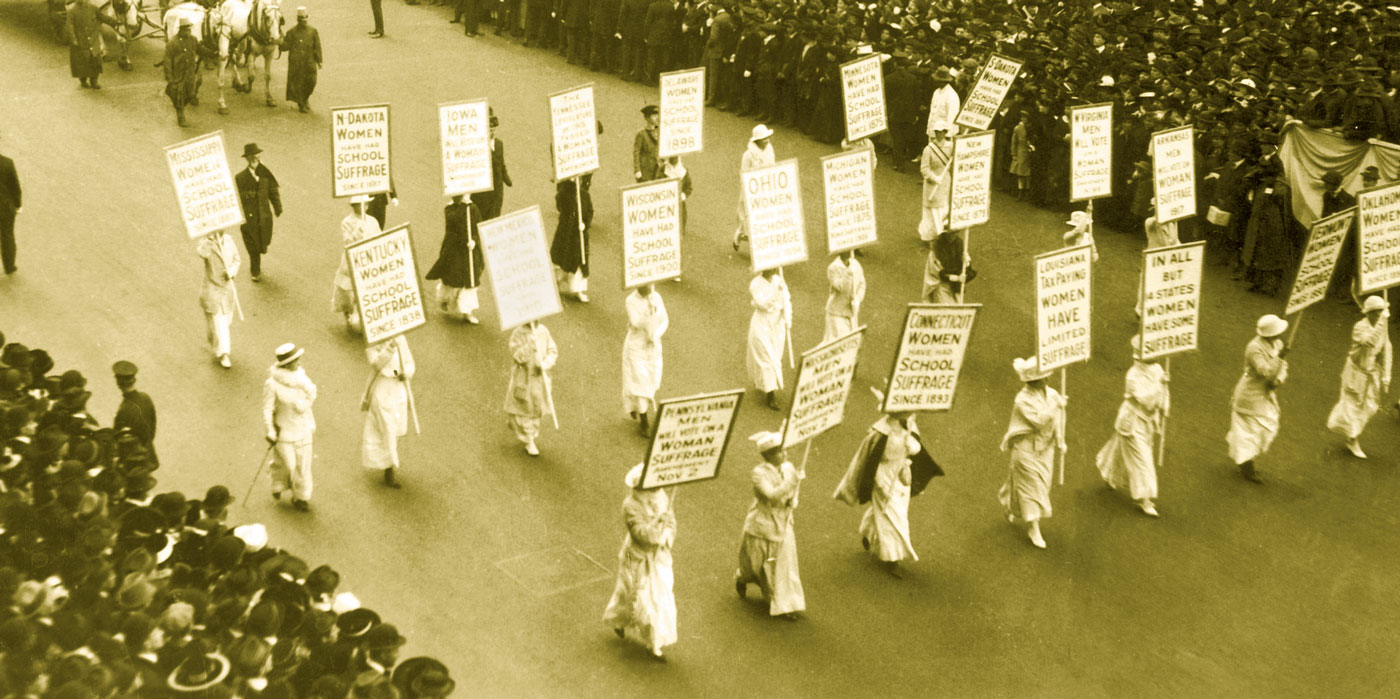 Photo of women marching in a suffrage parade.