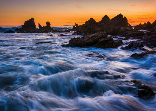View of waves crashing on rocks.