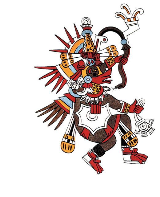 Man dressed in many feathers holding a snake.