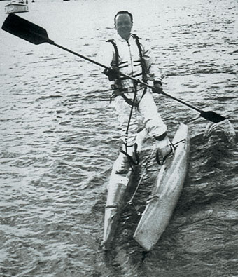 Remy Bricka rowing with waterskis on his feet.