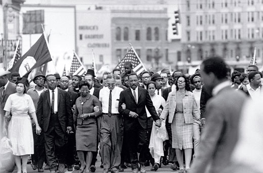 Martin Luther King Junior leading a crowd of people during a march to Selma Alabama.