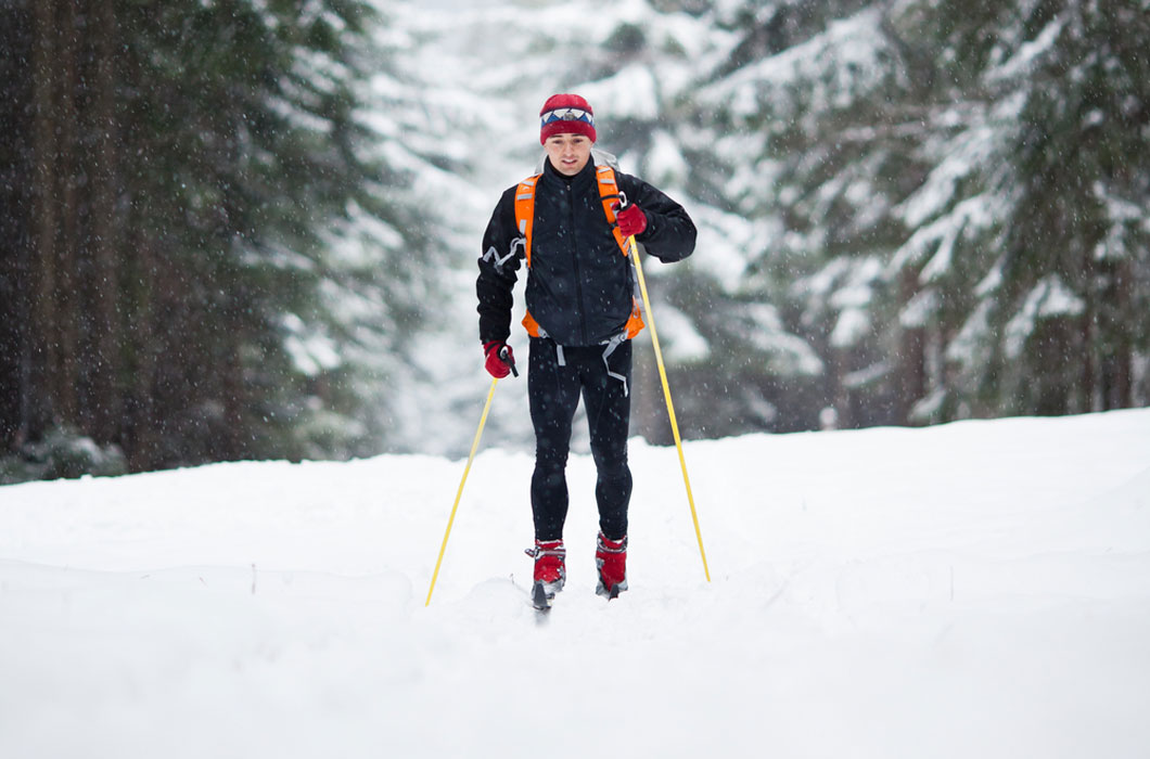 Man on skis navigates through the snow. 