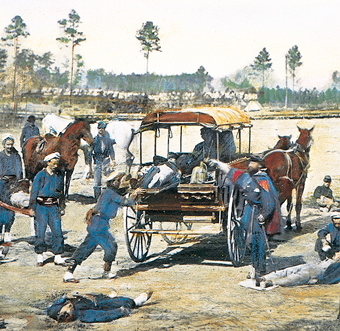 A horse-drawn wagon with injured soldiers.