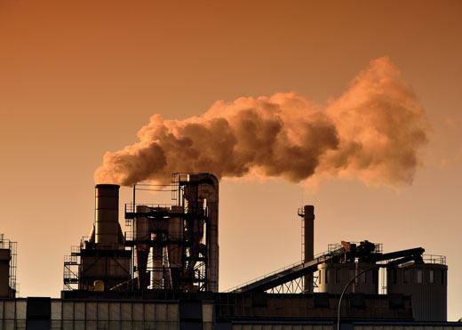 Factors releasing pollution from their smokestacks into the air. 
