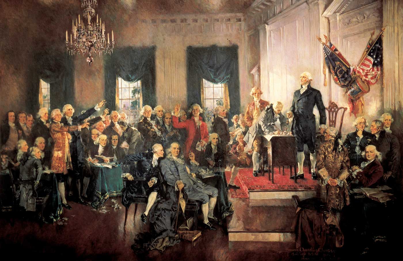 George Washington standing in front of several man at a meeting to write the Constitution.